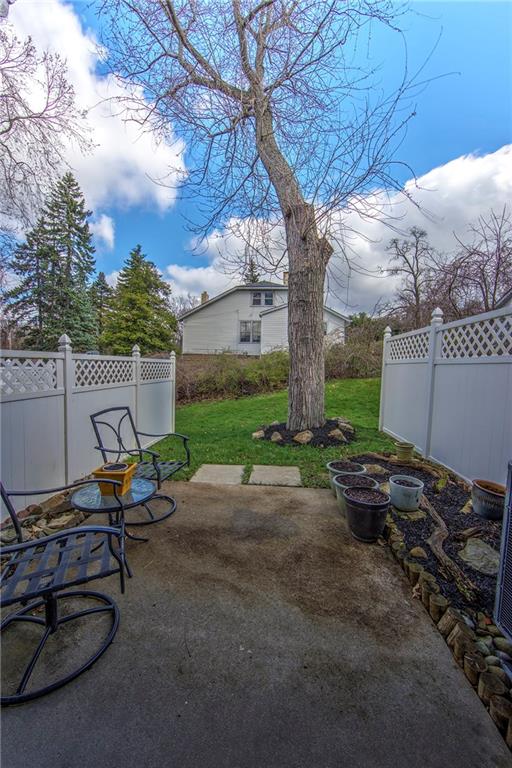 5497 Library Road, Unit 5 Bethel Park, PA 15102 - Photo 14 of 15 Cute patio with privacy fence on both sides.