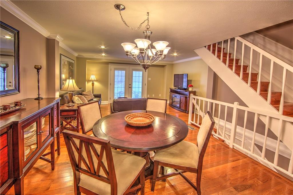 5497 Library Road, Unit 5 Bethel Park, PA 15102 - Photo 6 of 15 The staircase leading to the second floor is also hardwood.