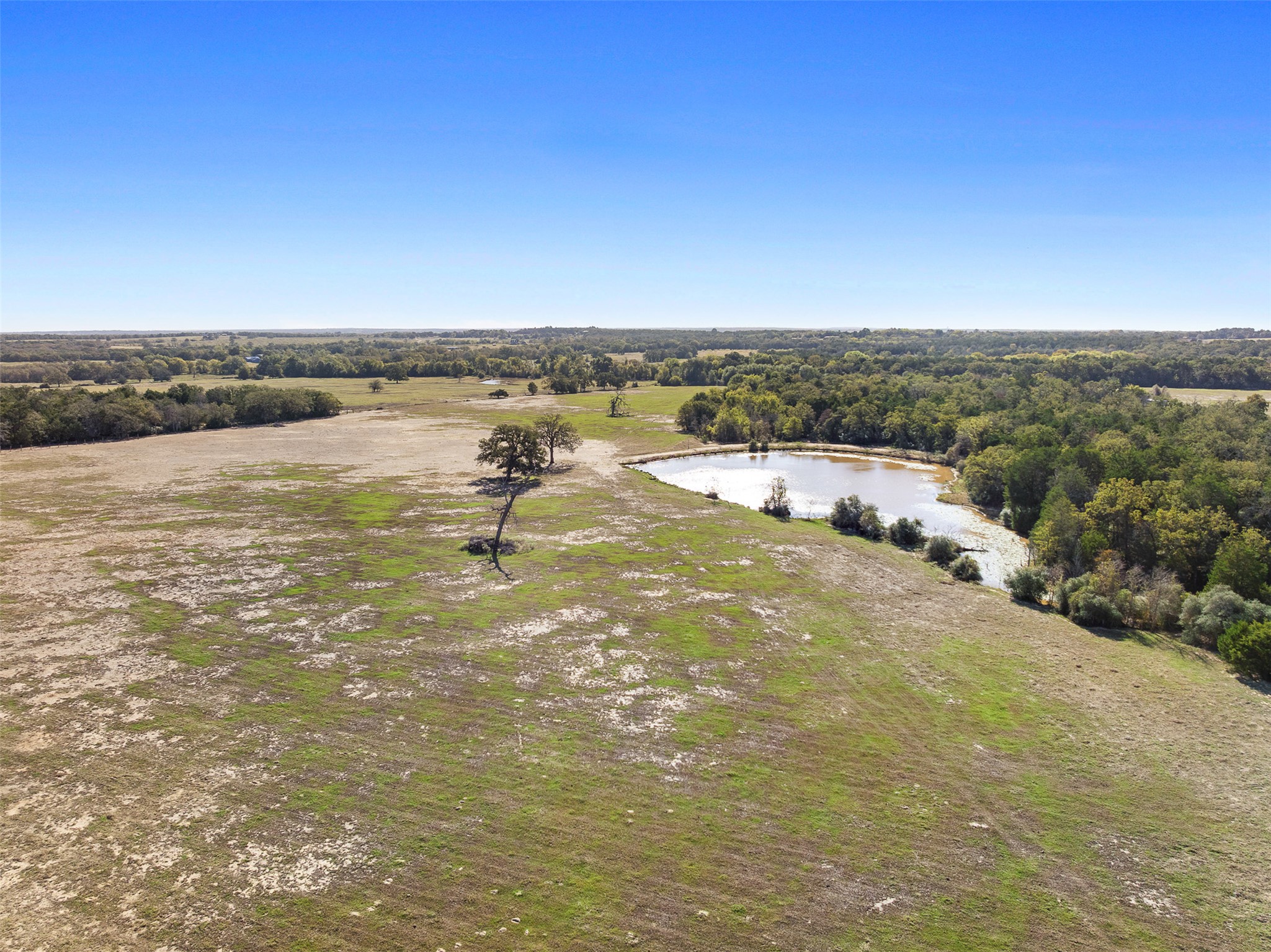 0 Stockade Ranch Road Paige, TX 78659 - Photo 22 of 37 Drone / aerial view of a nearby body of water