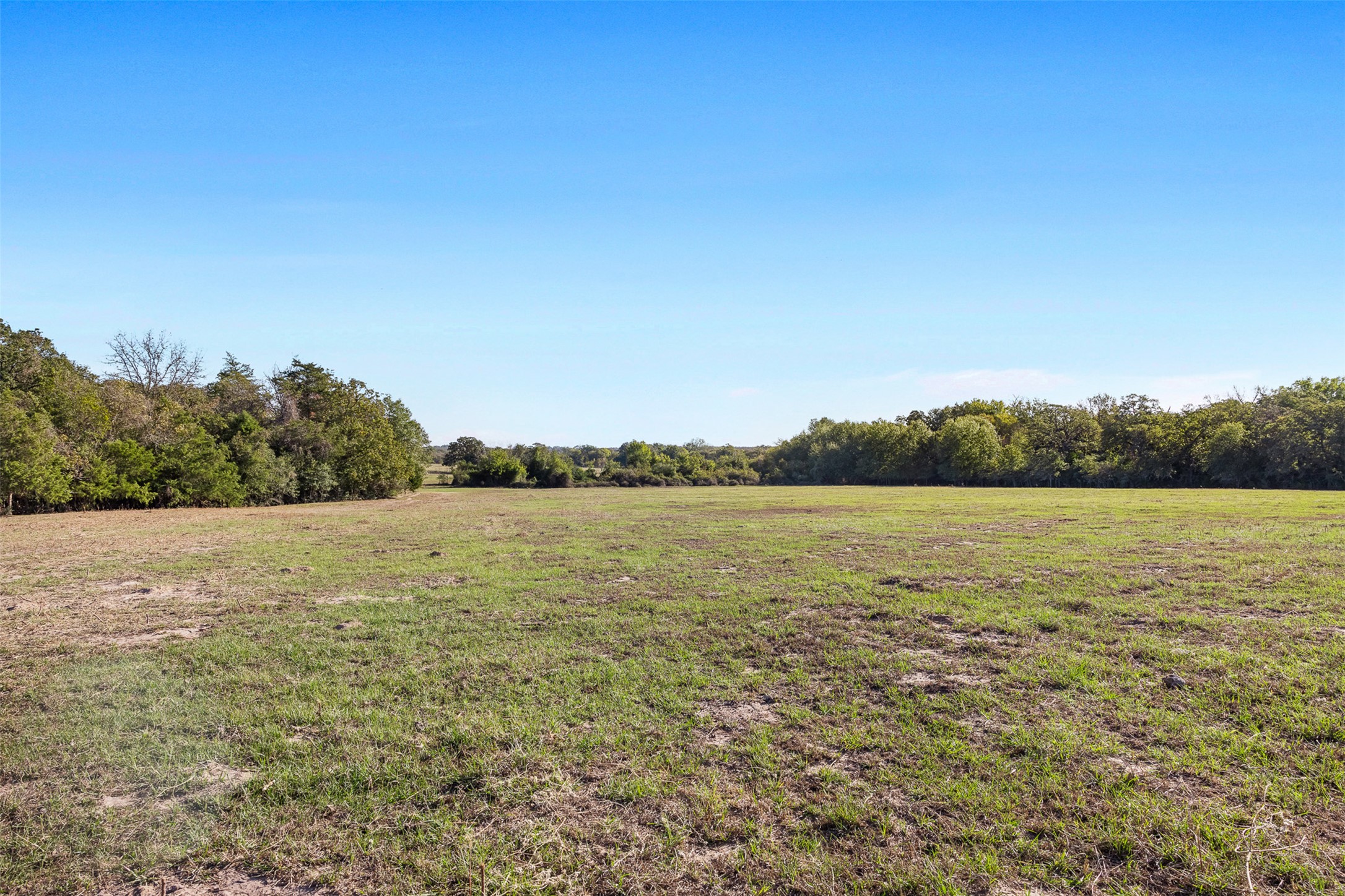 0 Stockade Ranch Road Paige, TX 78659 - Photo 8 of 37 View of green lawn with a view of countryside