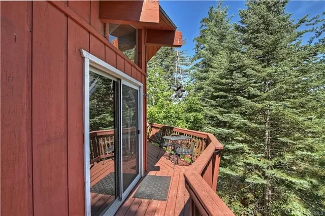 a view of deck with patio and wooden floor
