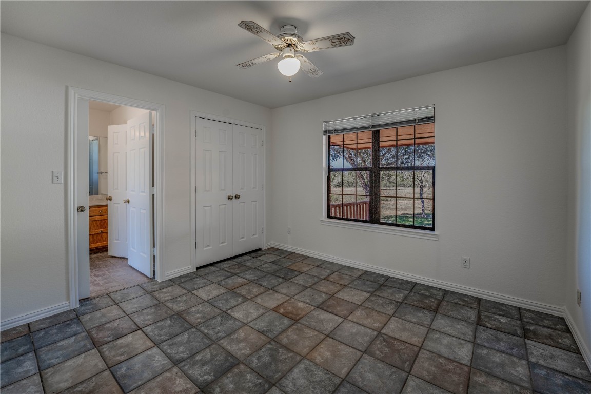 407 Raymond Road La Grange, TX 78945 - Photo 24 of 39 an empty room with windows and fan