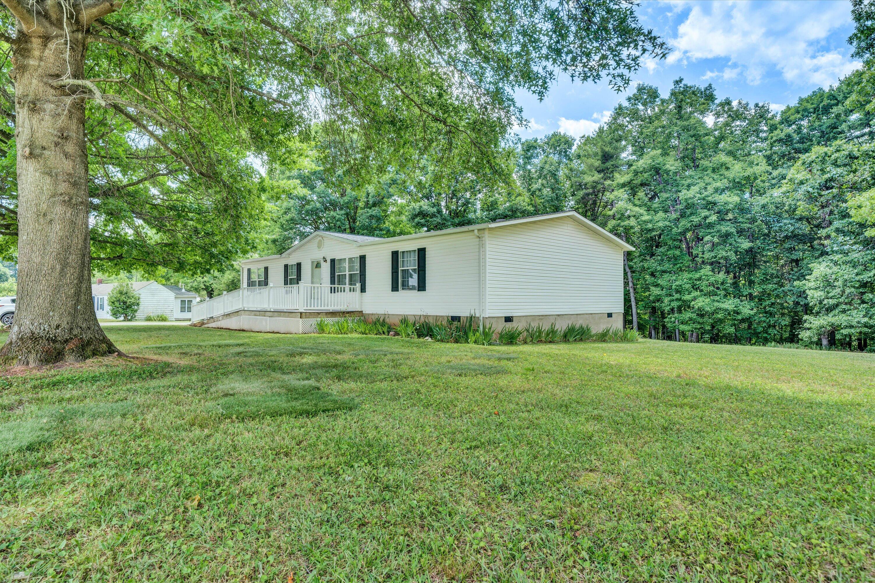 5232 Old Forge Road Rocky Mount, VA 24151 - Photo 1 of 41 a house view with a garden space