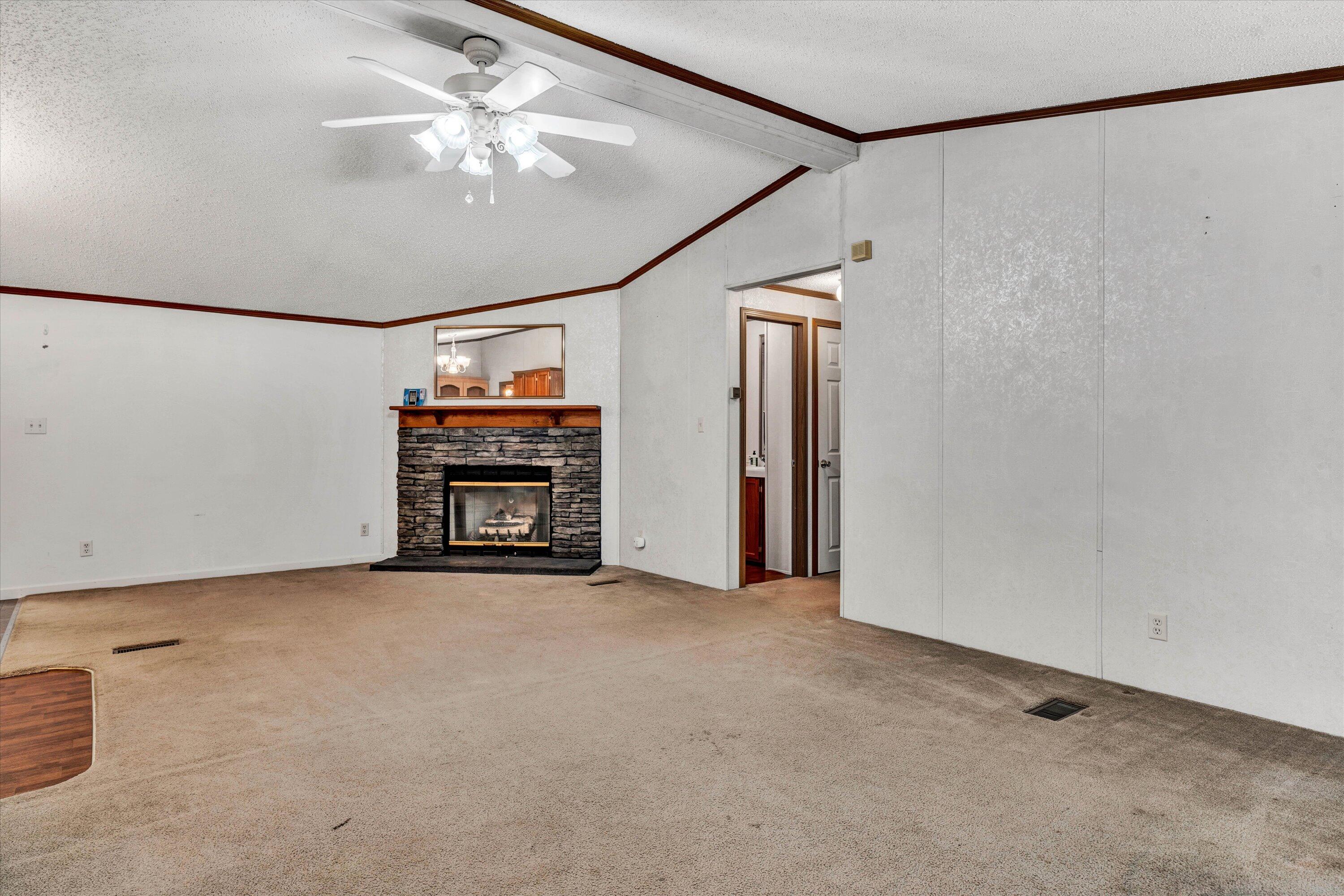 5232 Old Forge Road Rocky Mount, VA 24151 - Photo 10 of 41 an empty room with chandelier fan and windows