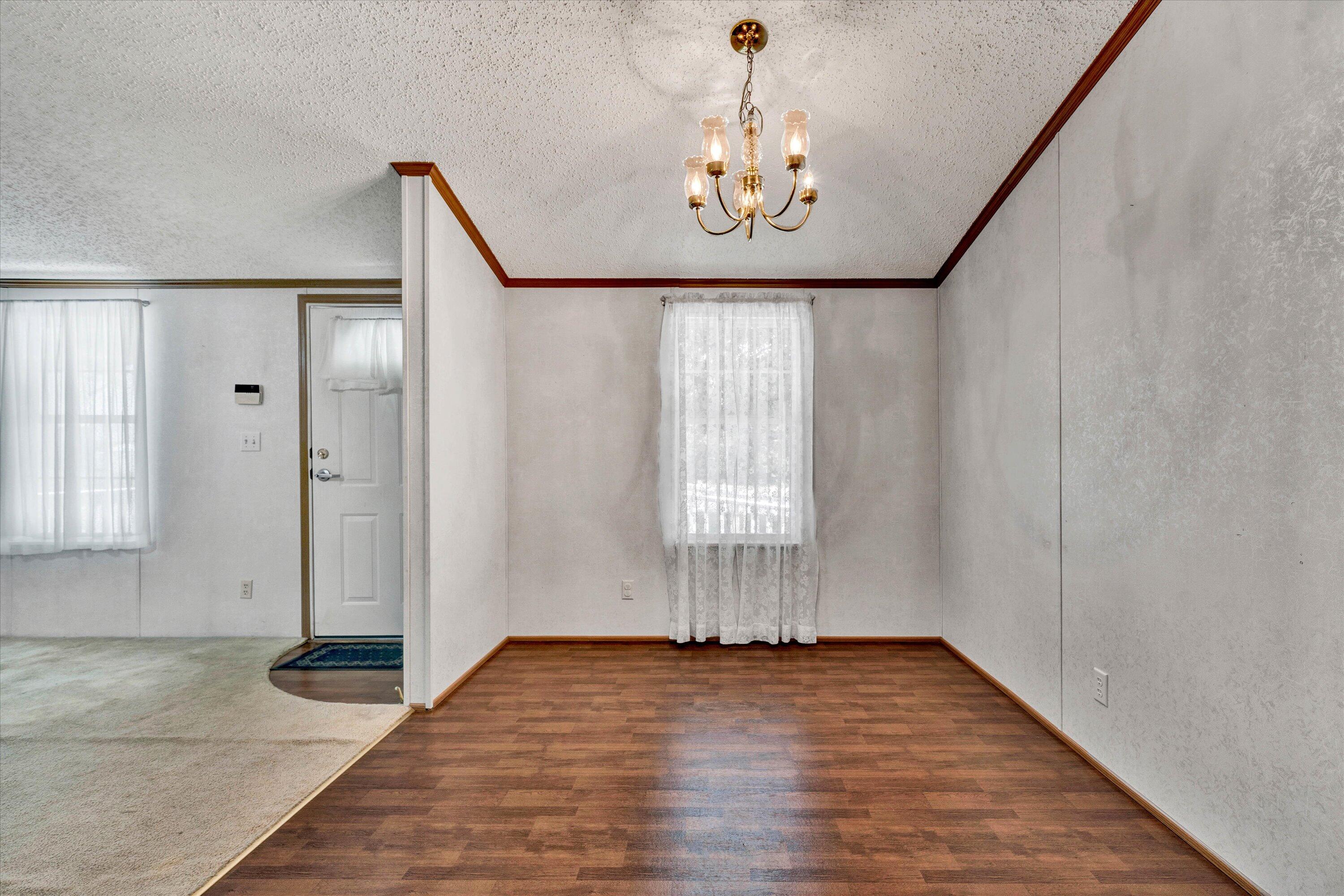 5232 Old Forge Road Rocky Mount, VA 24151 - Photo 16 of 41 a view of empty room with wooden floor and fan
