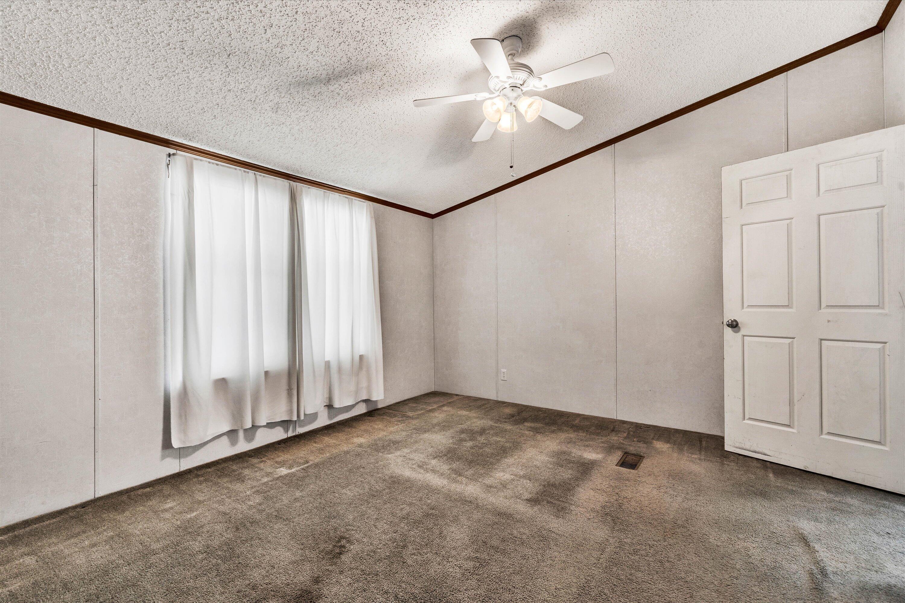 5232 Old Forge Road Rocky Mount, VA 24151 - Photo 18 of 41 an empty room with windows & fan view