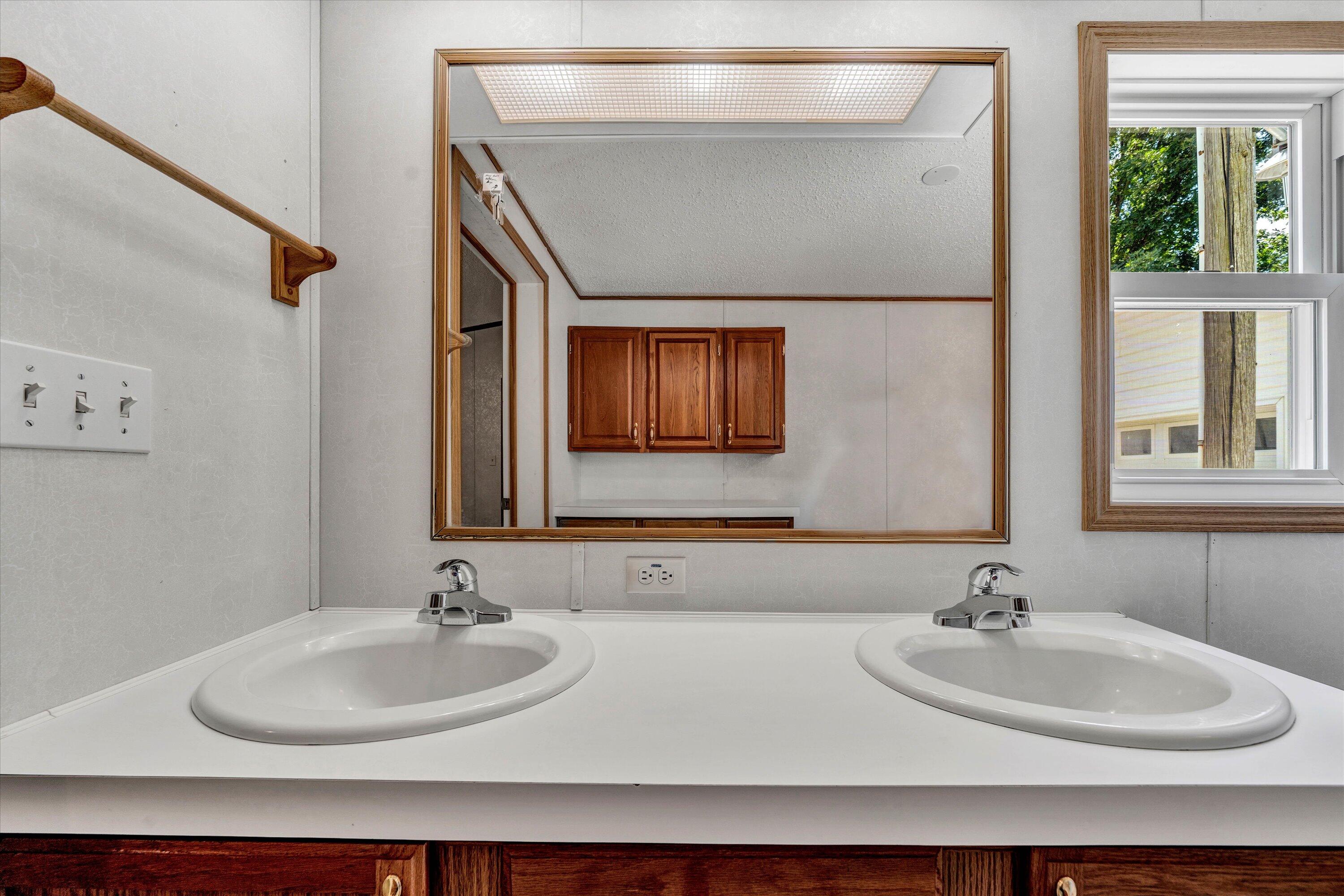 5232 Old Forge Road Rocky Mount, VA 24151 - Photo 21 of 41 a bathroom with a sink and a mirror