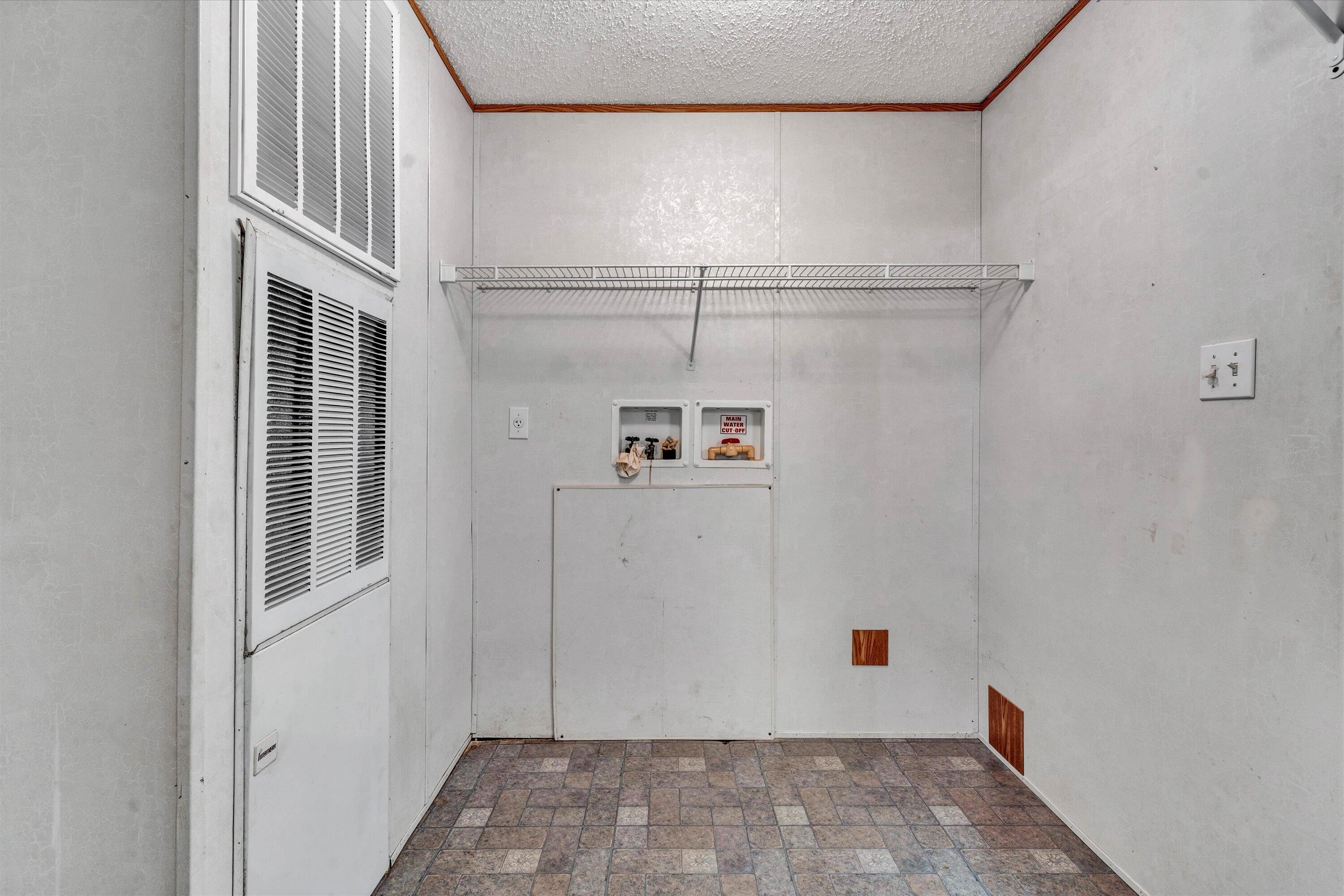 5232 Old Forge Road Rocky Mount, VA 24151 - Photo 24 of 41 a view of storage and utility room with racks on the wall