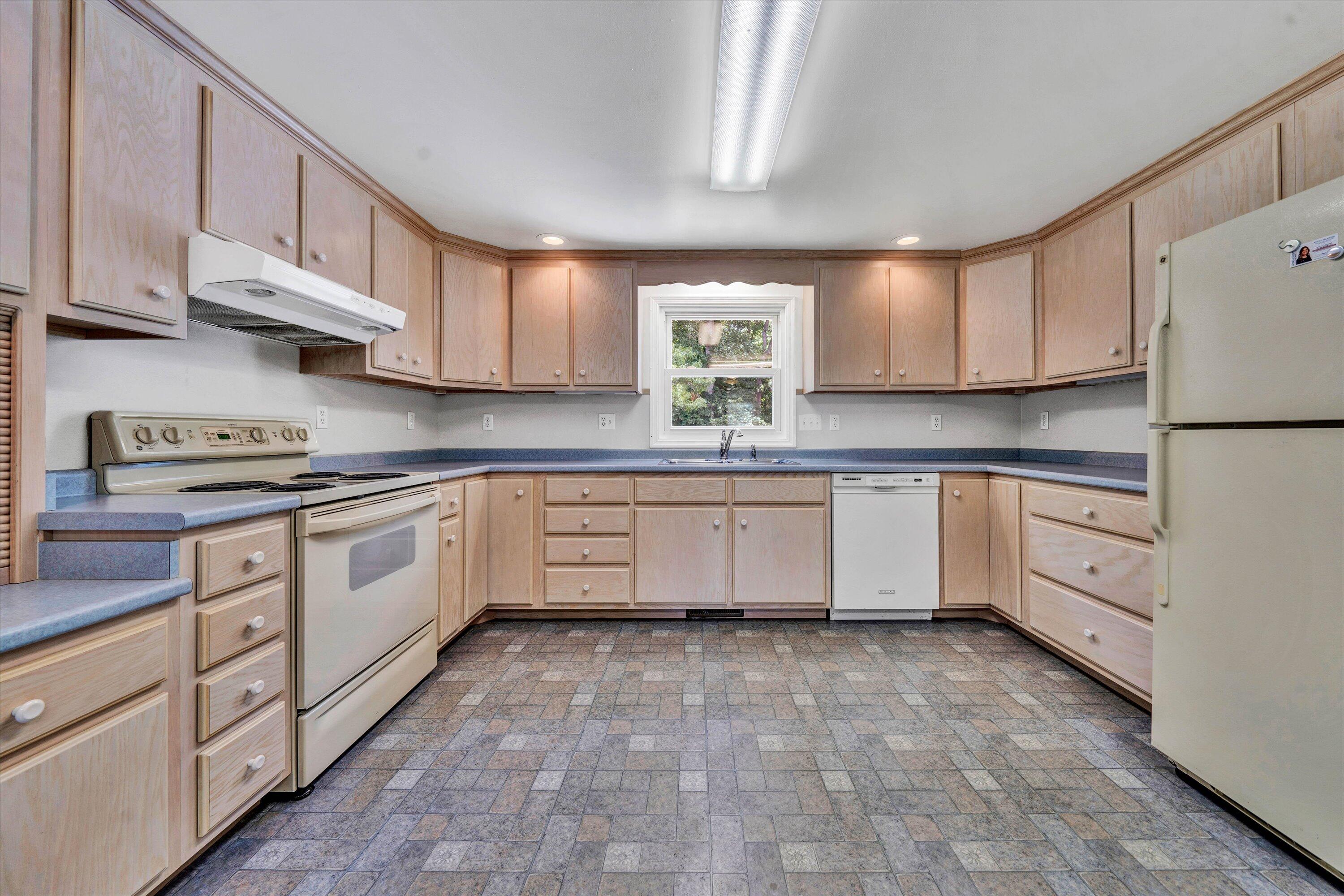 5232 Old Forge Road Rocky Mount, VA 24151 - Photo 26 of 41 a kitchen with white cabinets and white appliances
