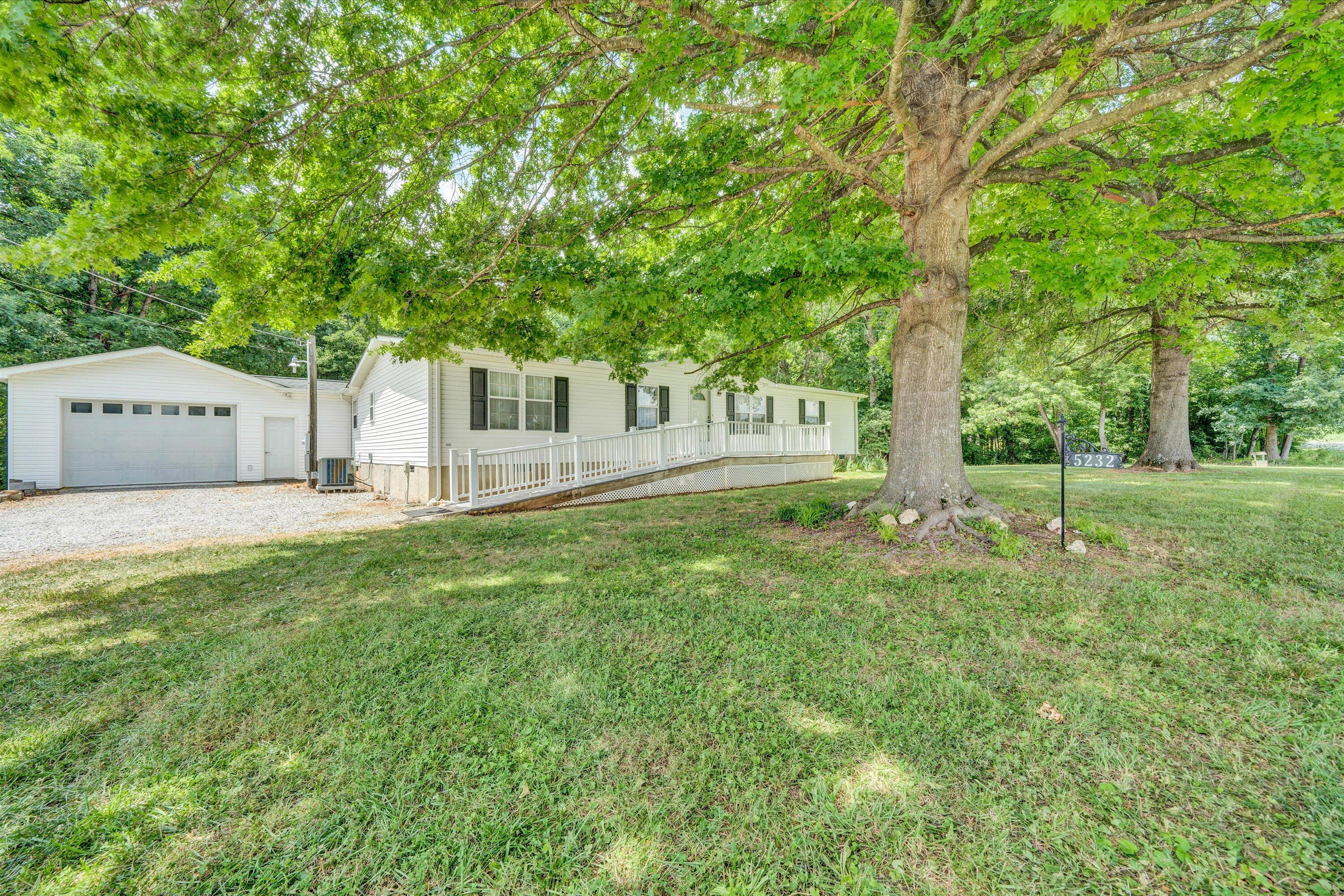 5232 Old Forge Road Rocky Mount, VA 24151 - Photo 3 of 41 a front view of a house with garden