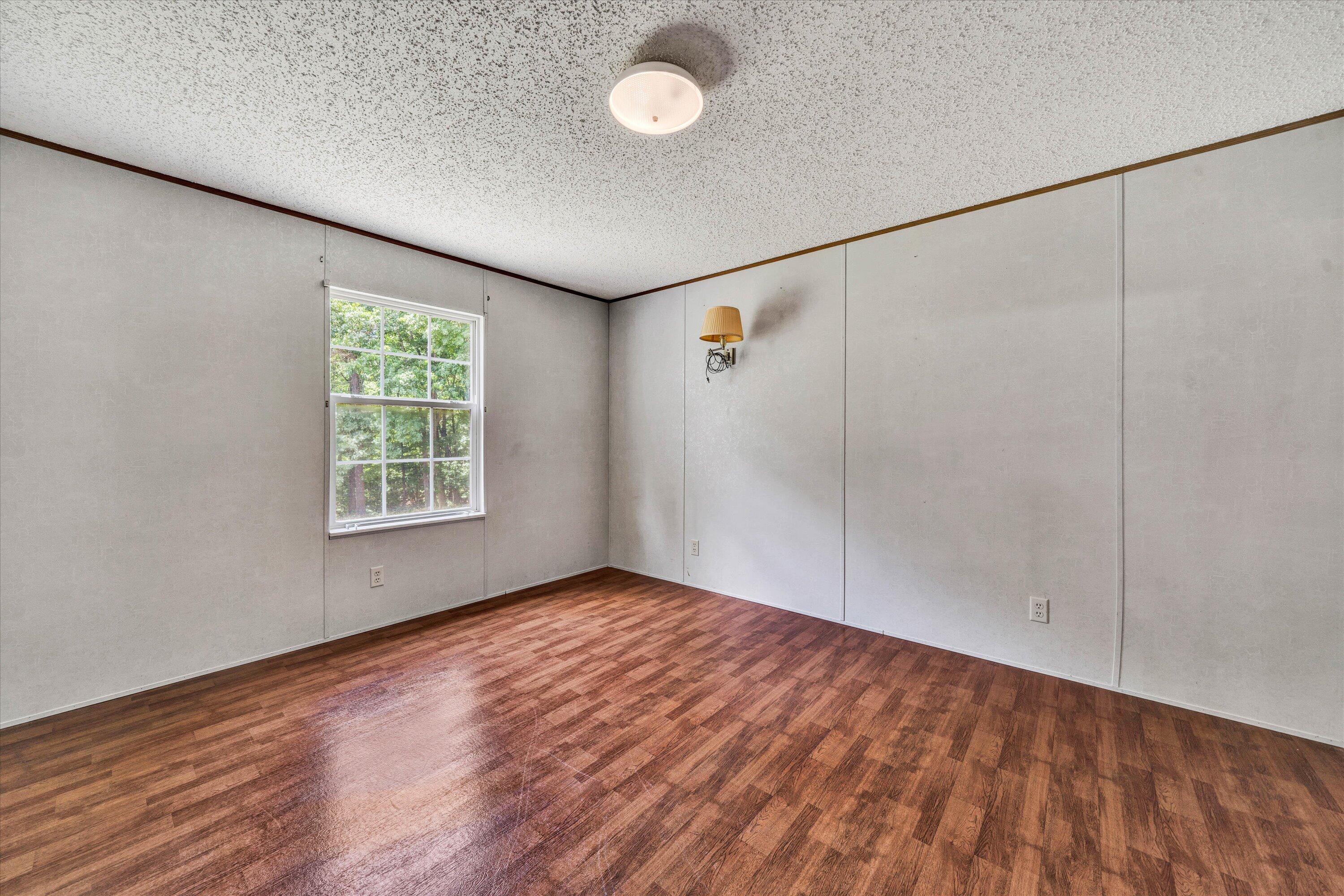 5232 Old Forge Road Rocky Mount, VA 24151 - Photo 33 of 41 wooden floor in an empty room with a window
