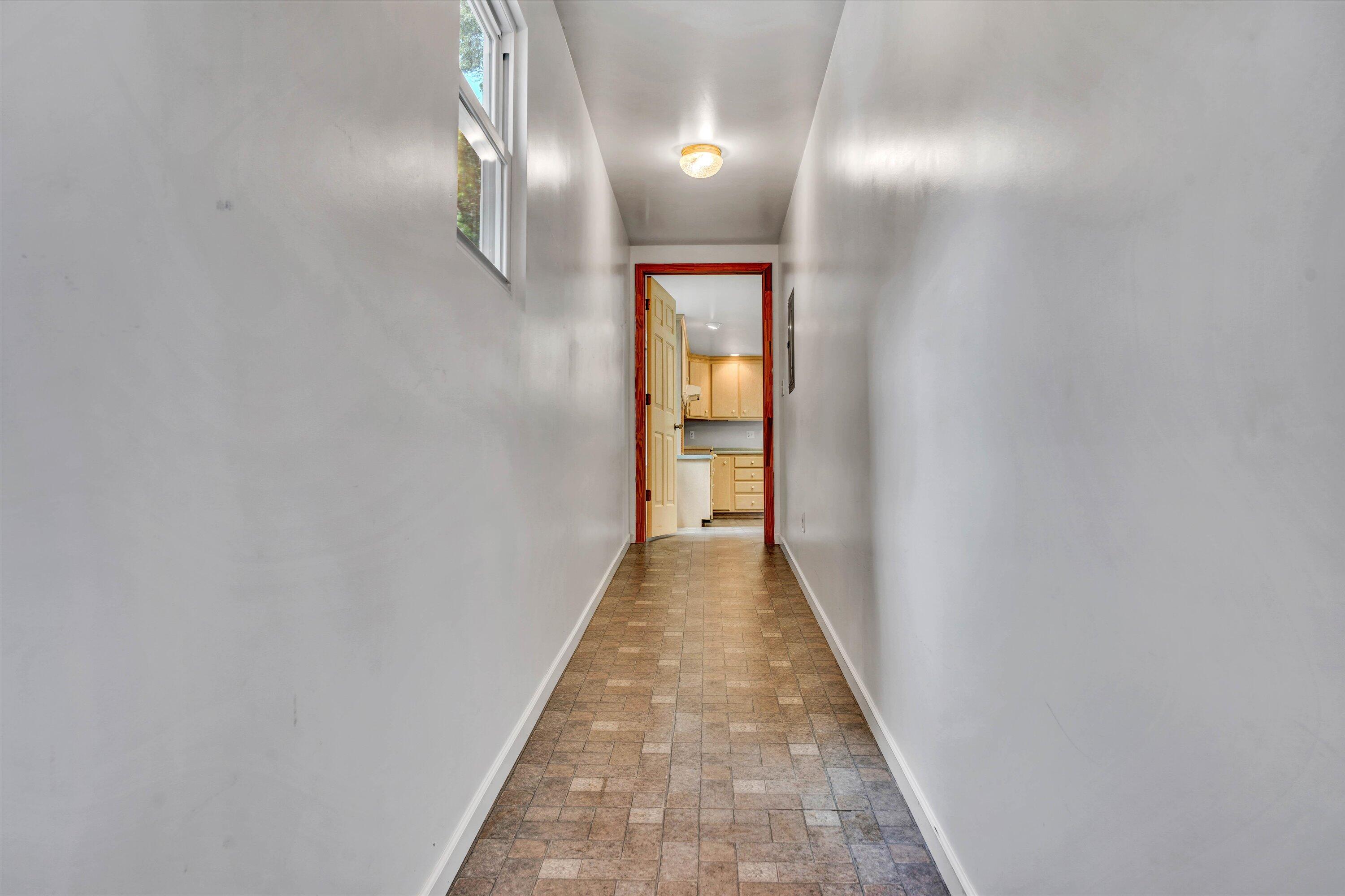5232 Old Forge Road Rocky Mount, VA 24151 - Photo 34 of 41 a view of a hallway with wooden floor