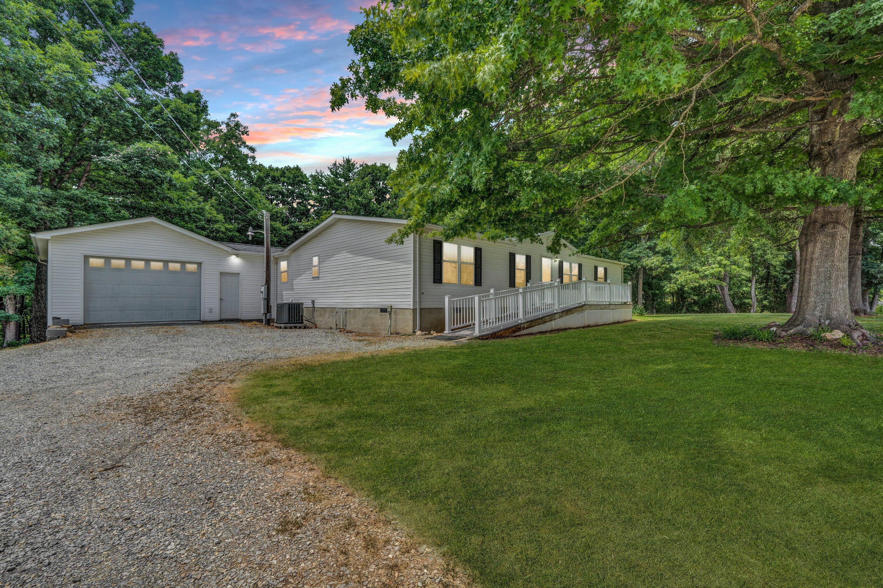 5232 Old Forge Road Rocky Mount, VA 24151 - Photo 4 of 41 a view of a house with backyard and garden