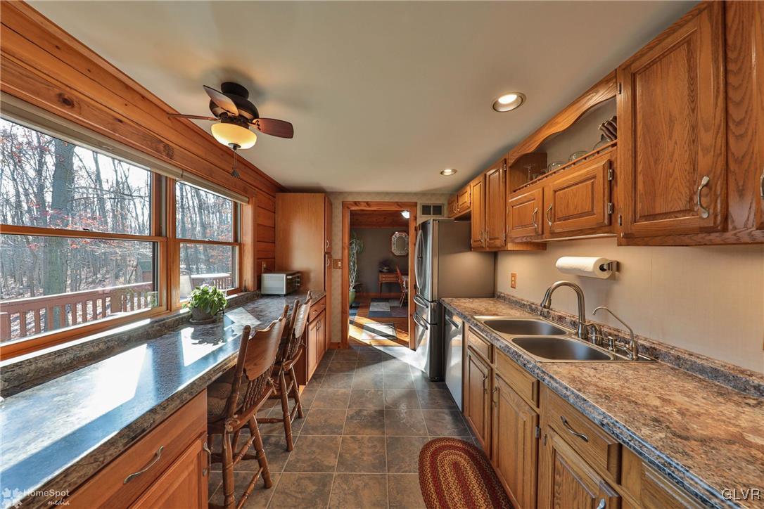2322 Mountain Road Slatington, PA 18080 - Photo 15 of 42 a kitchen with granite countertop a sink a counter top space appliances and cabinets