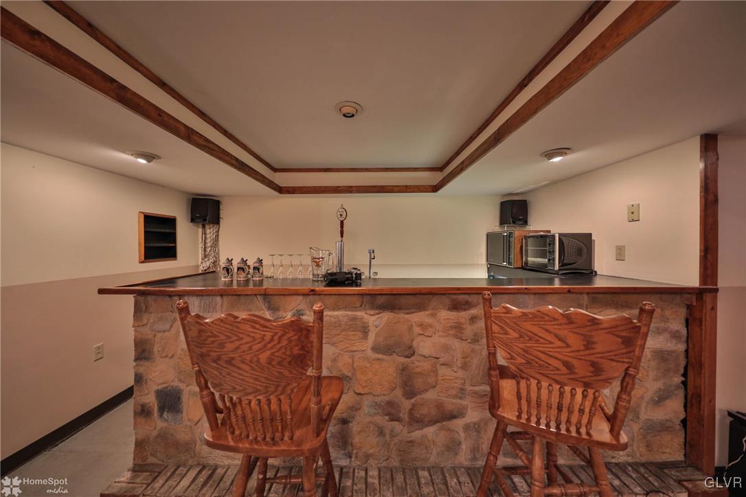 2322 Mountain Road Slatington, PA 18080 - Photo 22 of 42 a view of a kitchen with kitchen island and a wooden floor