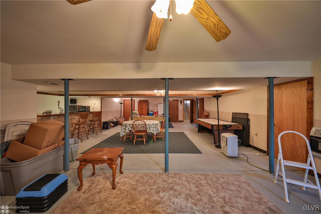 2322 Mountain Road Slatington, PA 18080 - Photo 25 of 42 a living room with furniture a rug and white walls