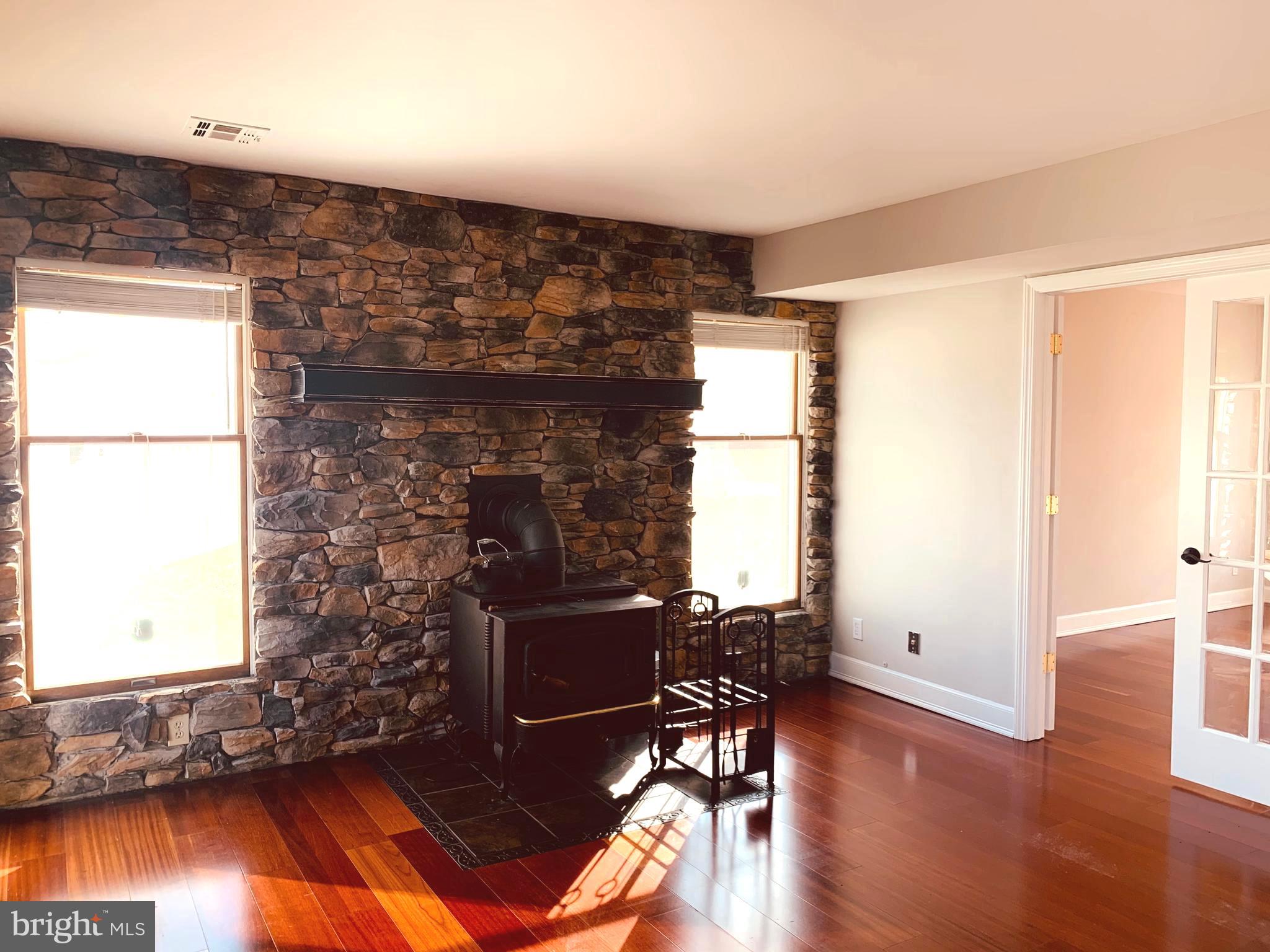 36 Manchester Road Mount Holly, NJ 08060 - Photo 12 of 31 WOOD STOVE/ STONE ACCENT WALL/ VIEW TO LIVING ROOM