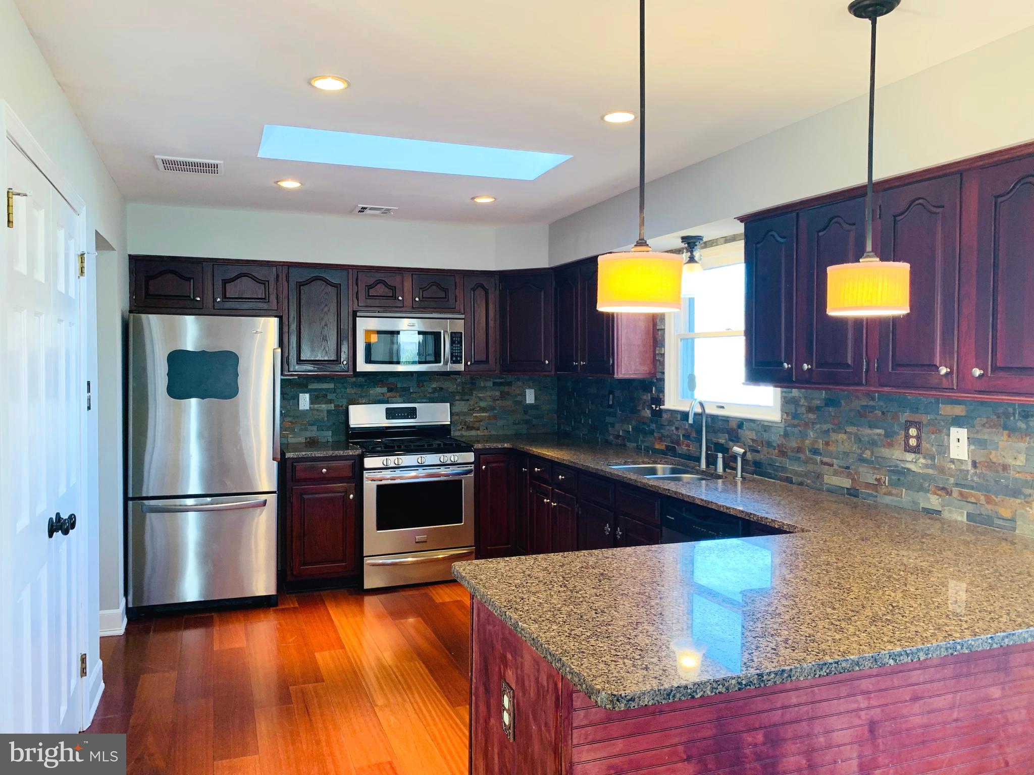 36 Manchester Road Mount Holly, NJ 08060 - Photo 6 of 31 KITCHEN WITH BREAKFAST BAR PENINSULA