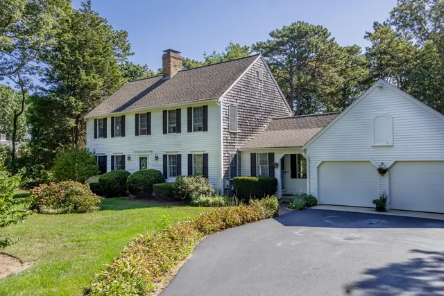 a view of a house with garden and plants