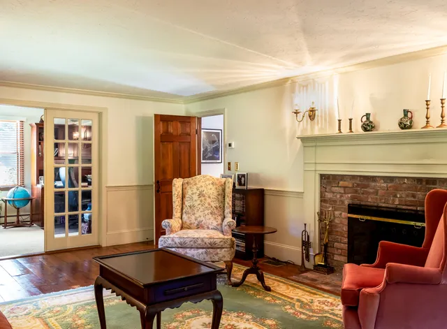 a living room with furniture or couch and a fireplace