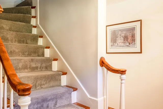 a view of stairs with furniture and stairs