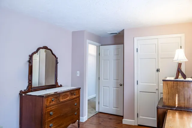 a view of living room with furniture and wooden floor