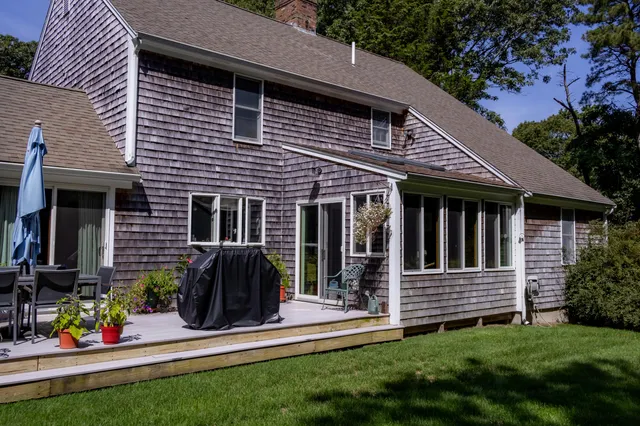 a view of a house with a yard and plants