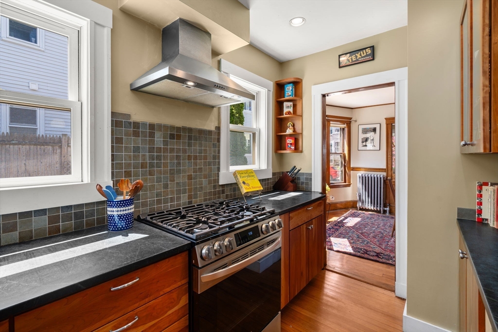 45 Springfield Street, Unit 1 Belmont, MA 02478 - Photo 13 of 27 a kitchen with stainless steel appliances granite countertop a stove and a sink