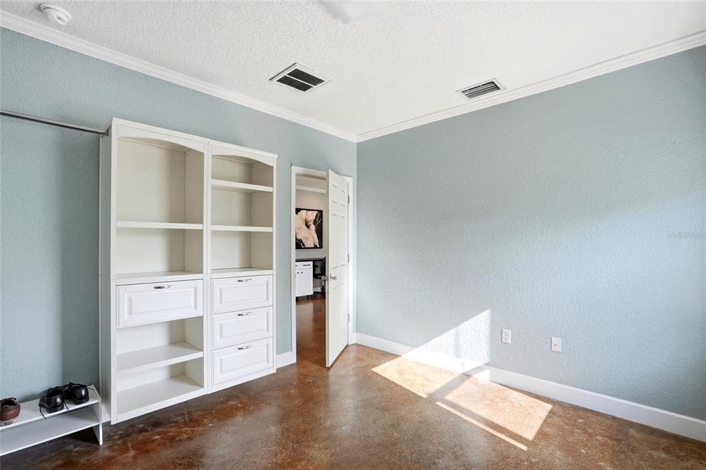 123 South Wiggins Road Plant City, FL 33566 - Photo 19 of 55 a view of an empty room with empty shelves