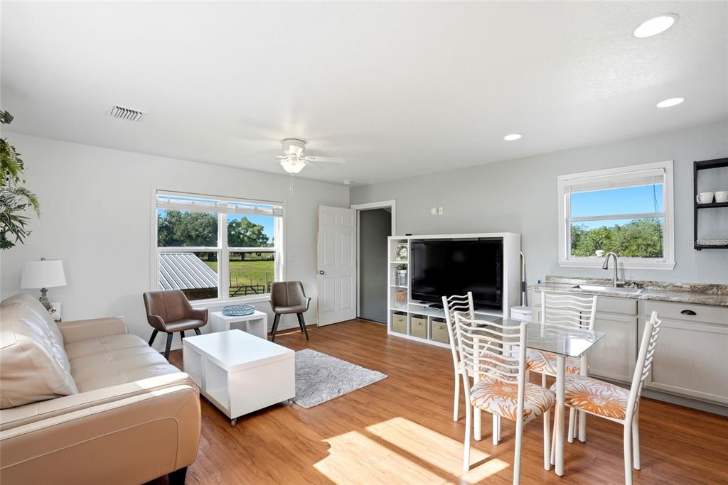 123 South Wiggins Road Plant City, FL 33566 - Photo 26 of 55 a living room with furniture and a flat screen tv