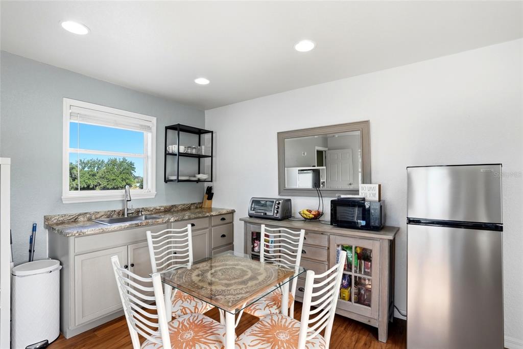 123 South Wiggins Road Plant City, FL 33566 - Photo 27 of 55 a living room with stainless steel appliances granite countertop furniture and a refrigerator