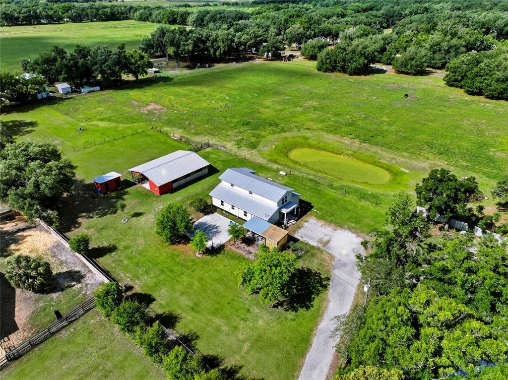 123 South Wiggins Road Plant City, FL 33566 - Photo 3 of 55 a view of a garden with a house
