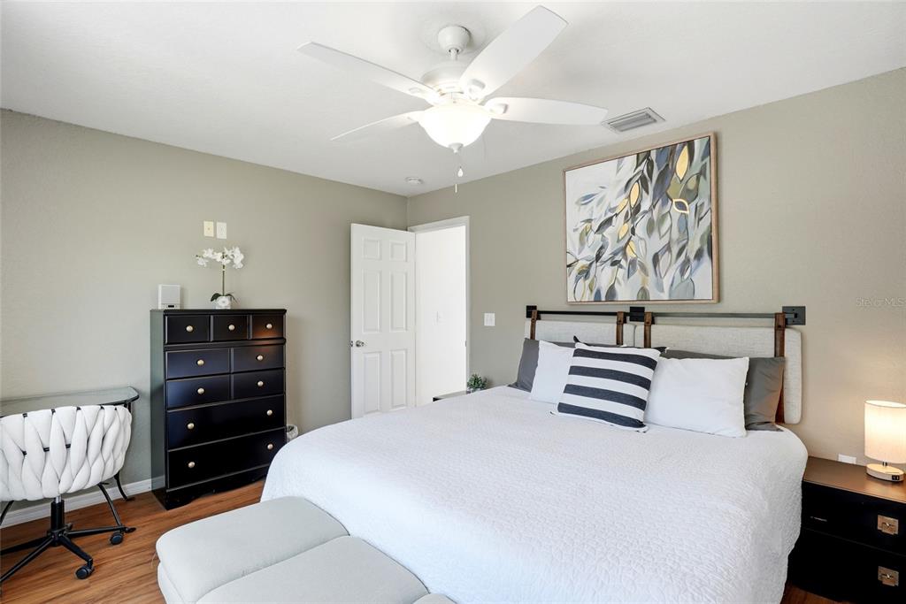 123 South Wiggins Road Plant City, FL 33566 - Photo 31 of 55 a bedroom with a bed and a dresser