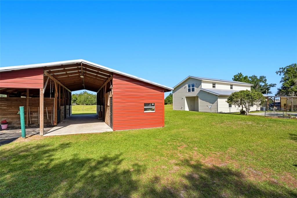 123 South Wiggins Road Plant City, FL 33566 - Photo 34 of 55 a front view of a house with garden