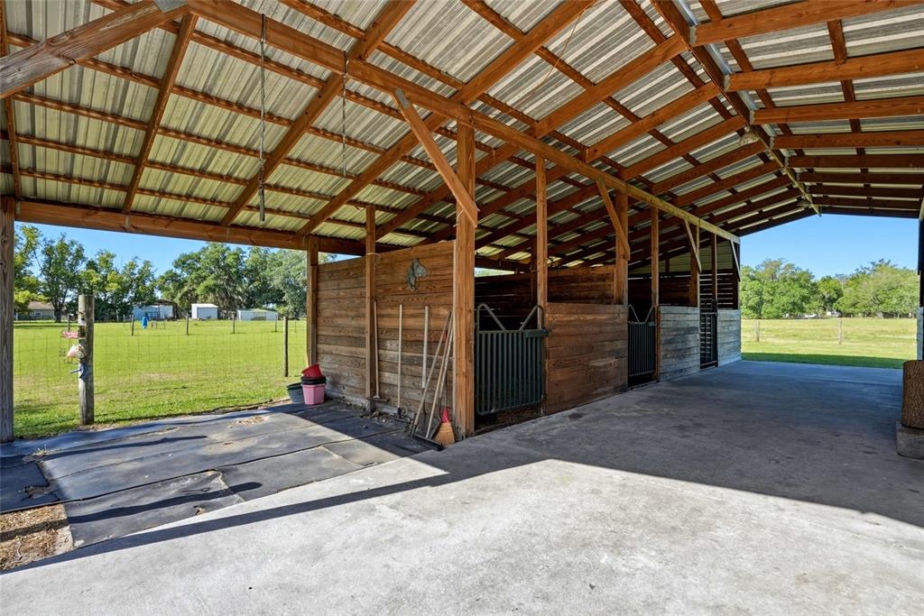 123 South Wiggins Road Plant City, FL 33566 - Photo 35 of 55 a view of a backyard with wooden floor and roof