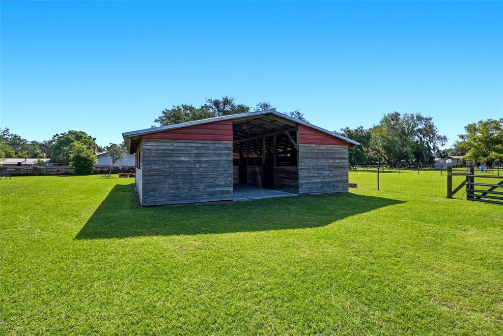 123 South Wiggins Road Plant City, FL 33566 - Photo 38 of 55 a view of a wooden fence with a yard