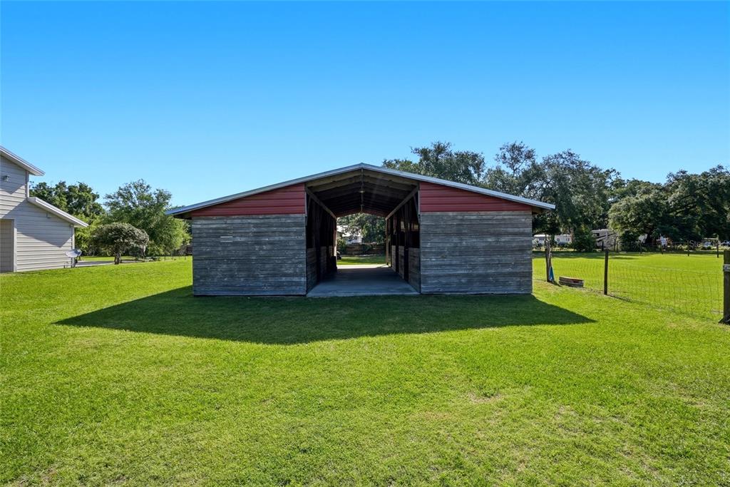 123 South Wiggins Road Plant City, FL 33566 - Photo 39 of 55 a backyard of a house with lots of green space