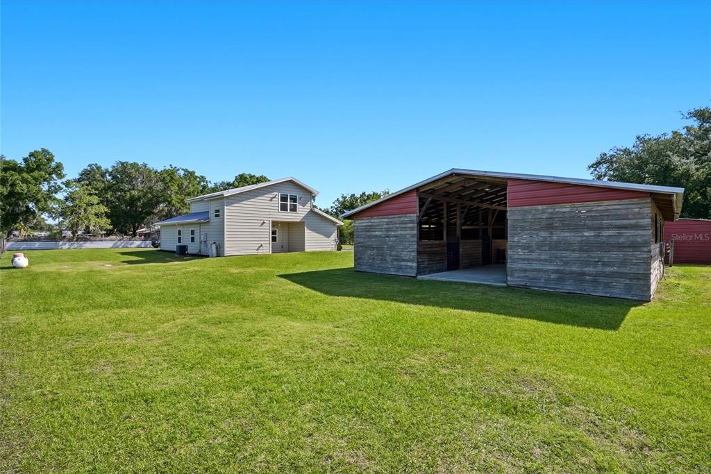 123 South Wiggins Road Plant City, FL 33566 - Photo 40 of 55 a view of a house with a backyard