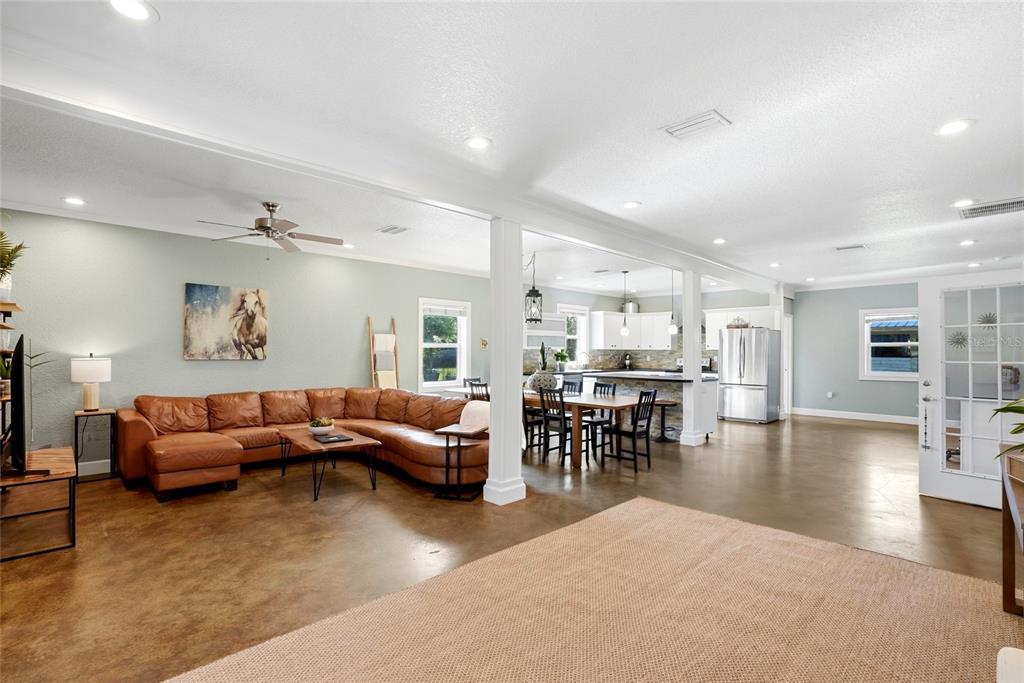 123 South Wiggins Road Plant City, FL 33566 - Photo 5 of 55 a living room with furniture and a table