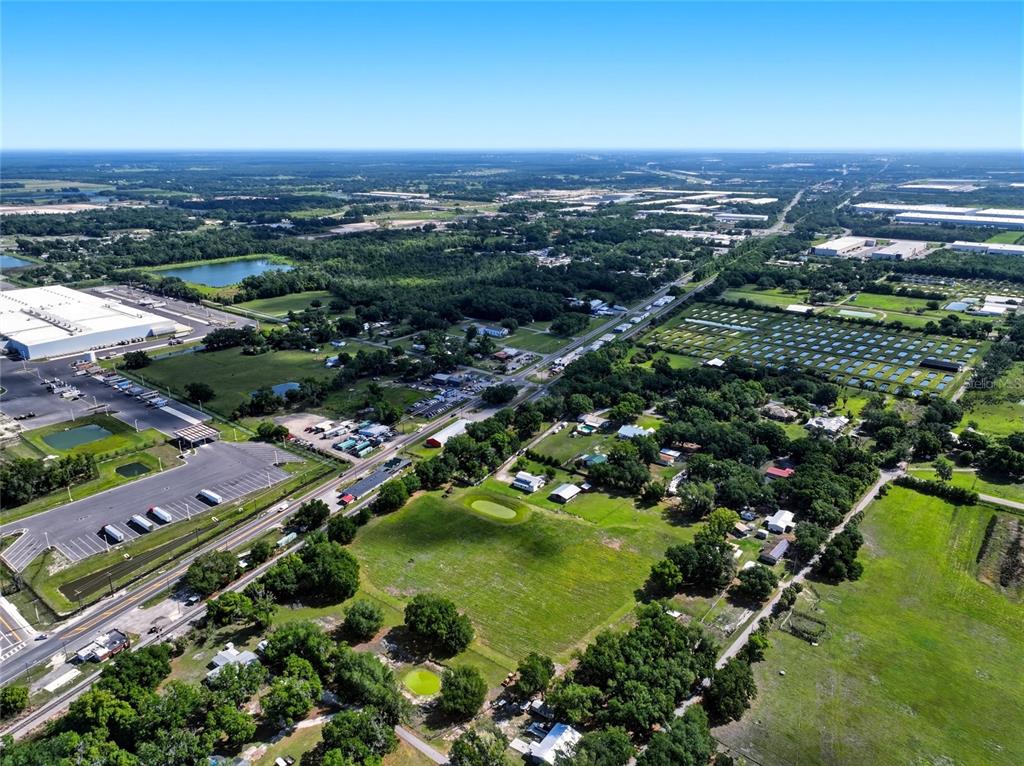 123 South Wiggins Road Plant City, FL 33566 - Photo 52 of 55 an aerial view of residential houses with outdoor space