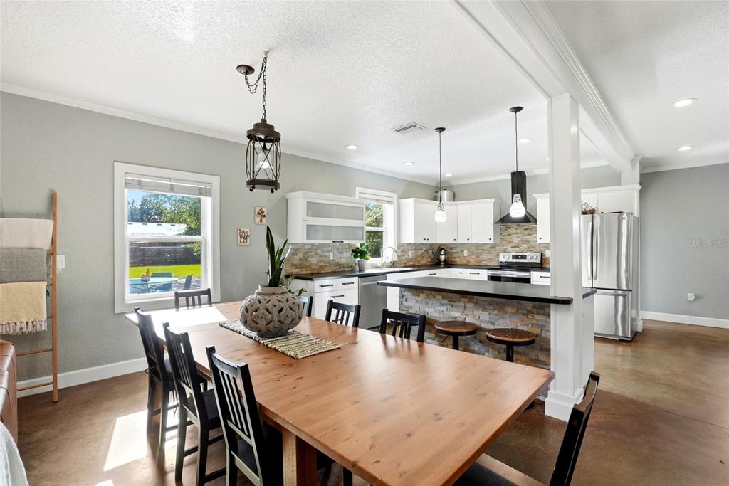 123 South Wiggins Road Plant City, FL 33566 - Photo 9 of 55 a large kitchen with a table and chairs