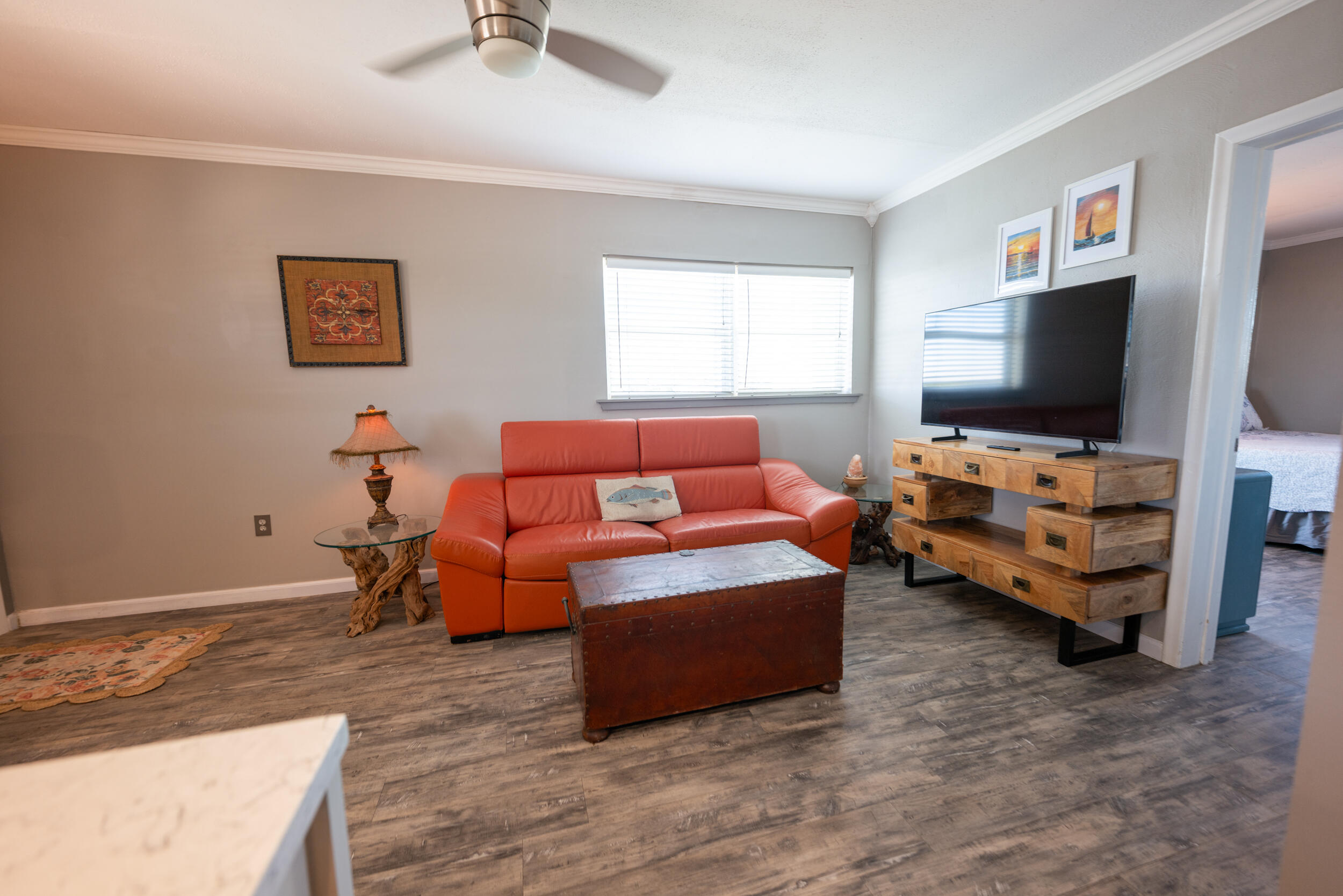 a living room with furniture and a flat screen tv