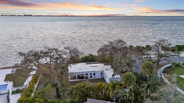 a aerial view of ocean with beach