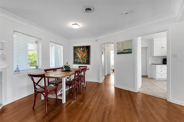 a view of a dining room with furniture and wooden floor
