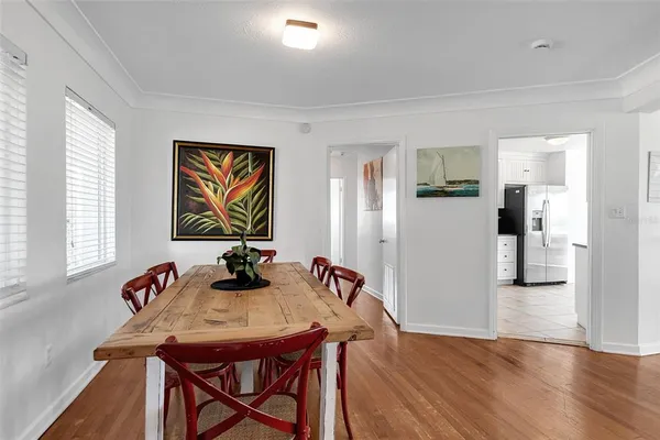 a view of a dining room with furniture and a window