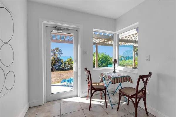 a view of a dining room with furniture window and outside view