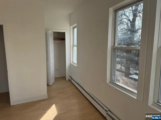 a view of an empty room with windows