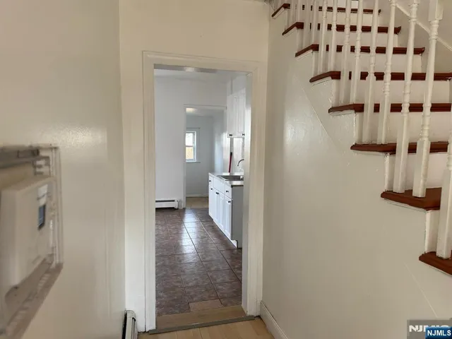 a view of a bathroom from a hallway