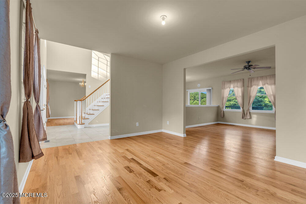 6 Eagle Ridge Lane West Creek, NJ 08092 - Photo 12 of 61 wooden floor in an empty room with a window