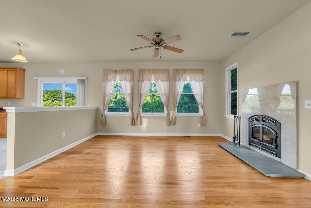 6 Eagle Ridge Lane West Creek, NJ 08092 - Photo 13 of 61 a view of empty room with wooden floor and fan